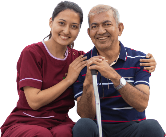 A Naman nurse with her arm around a smiling elderly resident — what drives us