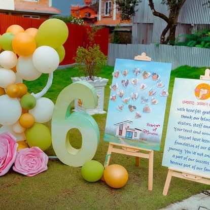 The 6-year anniversary display at Naman — balloon arch, welcome sign, and Heart of Memories board