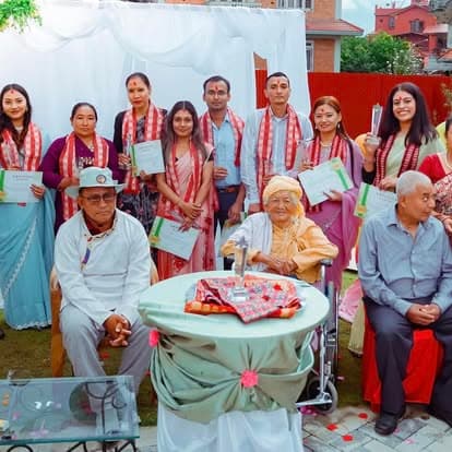 Naman residents and staff holding certificates at the 6-year anniversary
