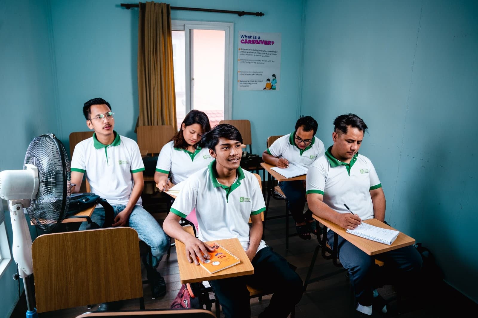 Naman Caregiver Training Institute students studying caregiving techniques in their classroom